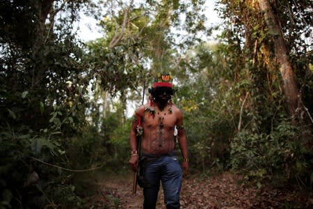 The Wider Image: Fighting fire with fire, Amazon 'forest guardians' stalk loggers