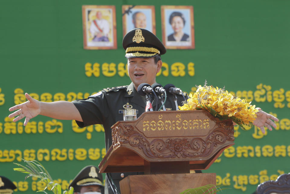 Son of Cambodian Prime Minister Hun Sen, Lt. Gen. Hun Manet delivers a speech while presiding over a military equipment delivery ceremony at the National Olympic Stadium in Phnom Penh, Cambodia, Thursday, June 18, 2020. Cambodia’s long-serving Prime Minister Hun Sen on Thursday, Dec. 2, 2021, explicitly declared his support to have his eldest son, army commander Hun Manet, eventually succeed him as the nation's leader. (AP Photo/Heng Sinith)
