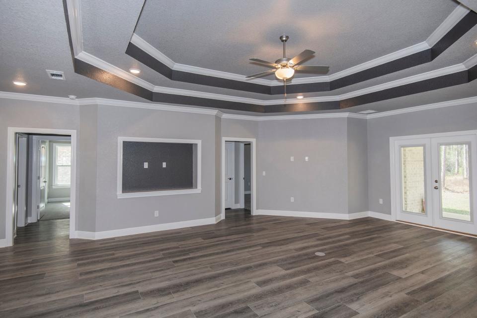 The living area of this home at 591 Nowak Road in Cantonment is brimming with natural light.