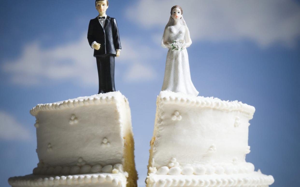 Wedding cake visual metaphor with figurine cake toppers - Rubberball/Mike Kemp/Getty Images