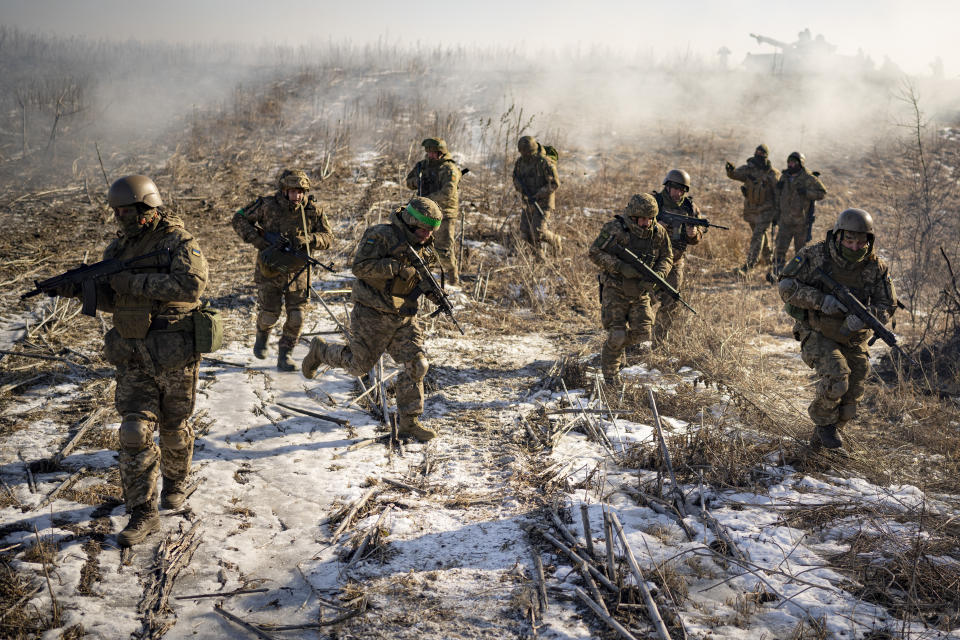 FILE - Ukrainian servicemen of the 3rd Separate Tank Iron Brigade take part in a drill, not far from the frontlines, in the Kharkiv area, Ukraine, Thursday, Feb. 23, 2023. Grueling artillery battles have stepped up in recent weeks in the vicinity of Kupiansk, a strategic town on the eastern edge of Kharkiv province by the banks of the Oskil River as Russian attacks intensifying in a push to capture the entire industrial heartland known as the Donbas, which includes the Donetsk and the Luhansk provinces. (AP Photo/Vadim Ghirda, File)