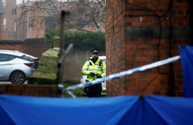 A police officer walks next to a property, which is being searched in connection with yesterday's stabbing on London Bridge, in which two people were killed, in Stafford