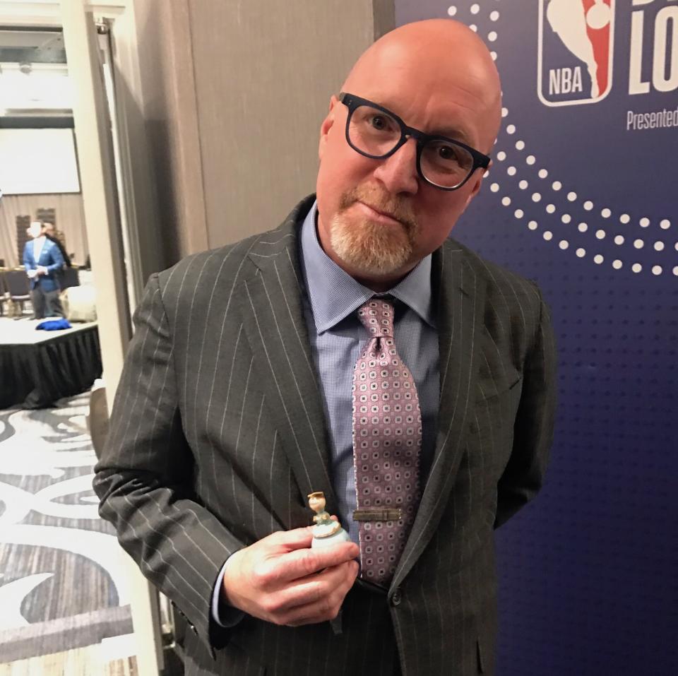 David Griffin poses with his good-luck angel Tuesday night. (Yahoo Sports)