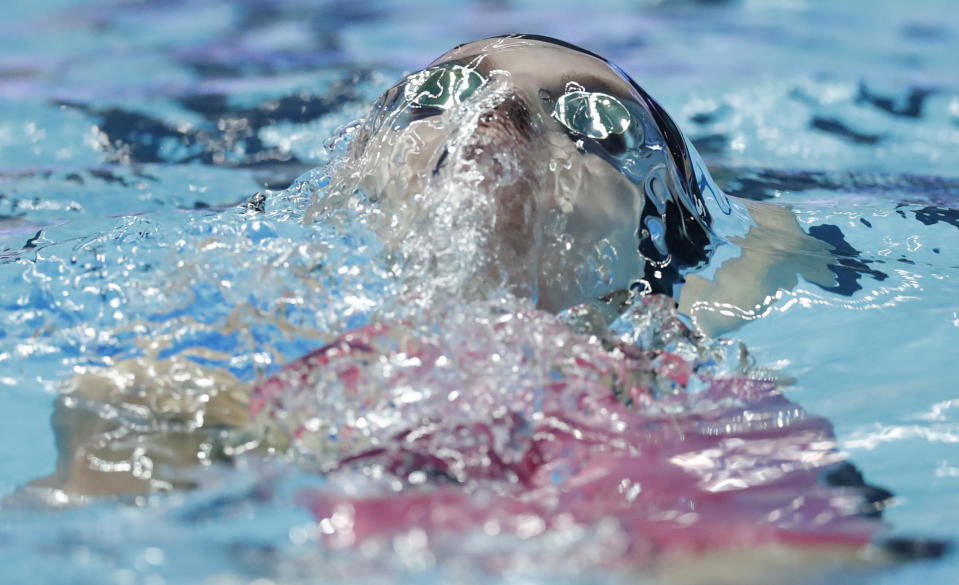 FILE - In this July 28, 2019 file photo, United States' Regan Smith swims the backstroke leg in the women's 4x100m medley relay final at the World Swimming Championships in Gwangju, South Korea. On Monday, March 30, 2020, the Tokyo Games were pushed back a full year by the coronavirus pandemic, to the same period of the biannual aquatics, causing the swimming’s governing body to go back to the drawing board to figure out when to hold its next world championships. (AP Photo/Lee Jin-man, file)