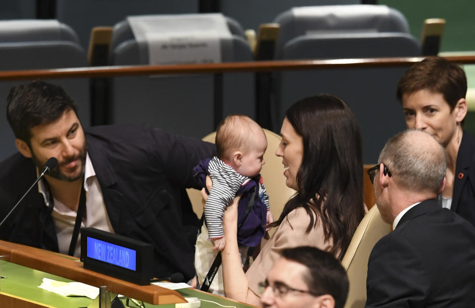 Jacinda Ardern, Prime Minister of New Zealand holds her daughter Neve Te Aroha Ardern Gayford, as her partner Clarke Gayford looks on during the Nelson Mandela Peace Summit September 24, 2018