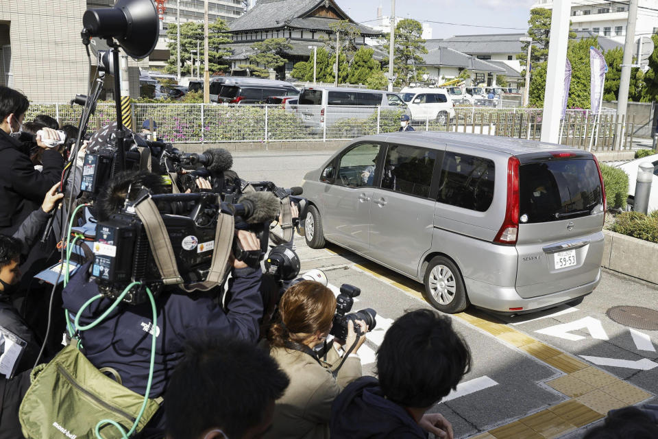 A vehicle carries Ryuji Kimura, a suspect in Saturday's attack during Japanese Prime Minister Fumio Kishida's visit at a port, as it leaves a police station to send him to prosecutors in Wakayama, western Japan Monday, April 17, 2023. Japanese police have confiscated metal tubes, tools and possible gunpowder from the home of the suspect who threw an explosive at Kishida at a campaign venue as investigators examine a possibility the alleged attacker used a home-made tube bomb, rekindling concern about growing threat of easy-to-make weapons. (Kyodo News via AP)