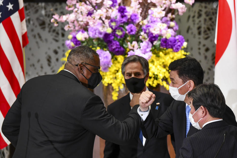 TOKYO, JAPAN - MARCH 16 : US Defense Secretary Lloyd Austin (L) and Secretary of State Antony Blinken (2nd L) leave after their joint press conference with Japan's Foreign Minister Toshimitsu Motegi (R) and Defence Minister Nobuo Kishi (2nd R) after their 2+2 meeting at Iikura Guest House in Tokyo on March 16, 2021. (Photo by AFP/KAZUHIRO NOGI/Pool/Anadolu Agency via Getty Images)