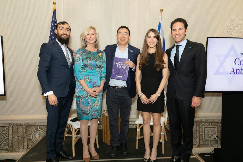 Summit Director Shneor Minsky, from left, President Emerita of Babson College Kerry Healey, former Democratic presidential candidate Andrew Yang and summit co-chairs Nolan and Michael Greenwald