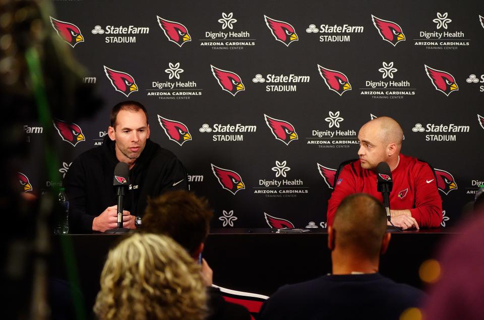 Drew Petzing (right), the Arizona Cardinals' new offensive coordinator, listens to head coach Jonathan Gannon during an introductory news conference for Petzing at the Cardinals practice facility in Tempe on Feb. 23, 2023.