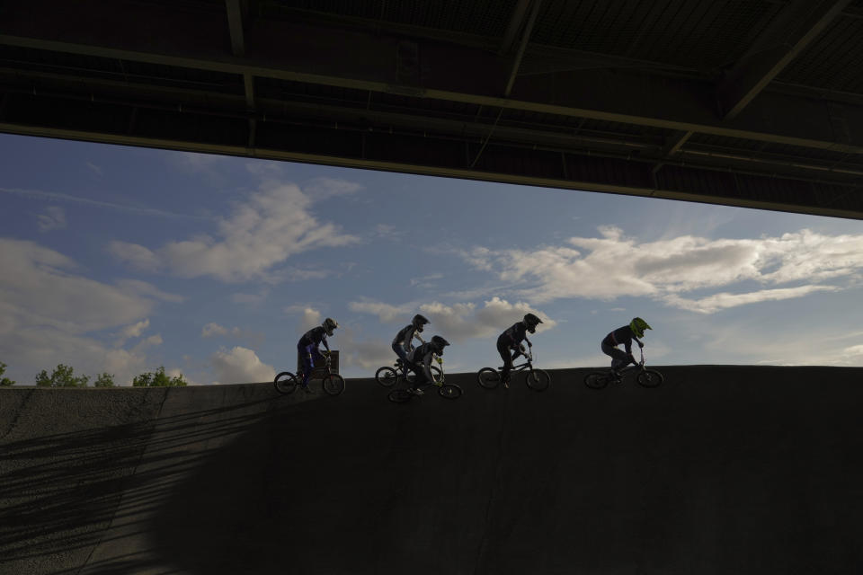 Members of France's BMX team demonstrate at the BMX Stadium, in Saint-Quentin-en Yvelines, west of Paris, Thursday, May 11, 2023. The venue will host the cycling BMX racing competitions during the Paris 2024 Olympic Games. (AP Photo/Thibault Camus, File)