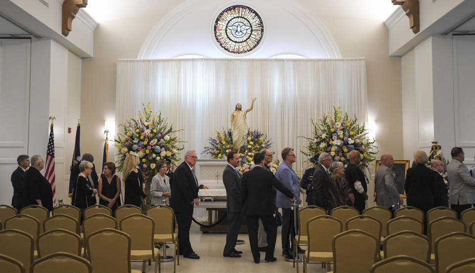 People file past the casket of former Louisiana Gov. Kathleen Blanco during a visitation at St. John's Cathedral Hall, Friday, Aug. 23, 2019, in Lafayette, La. Blanco, who served one term as governor and various elected positions across two decades, was in Louisiana’s top job during the destruction of hurricanes Katrina and Rita in 2005. She died a week earlier from cancer. (Brad Kemp/The Advocate via AP)