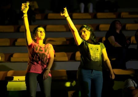 Young women dance as they attend electronic music concert with western tunes at closed Hall in Shaab Stadium for the first time in Baghdad