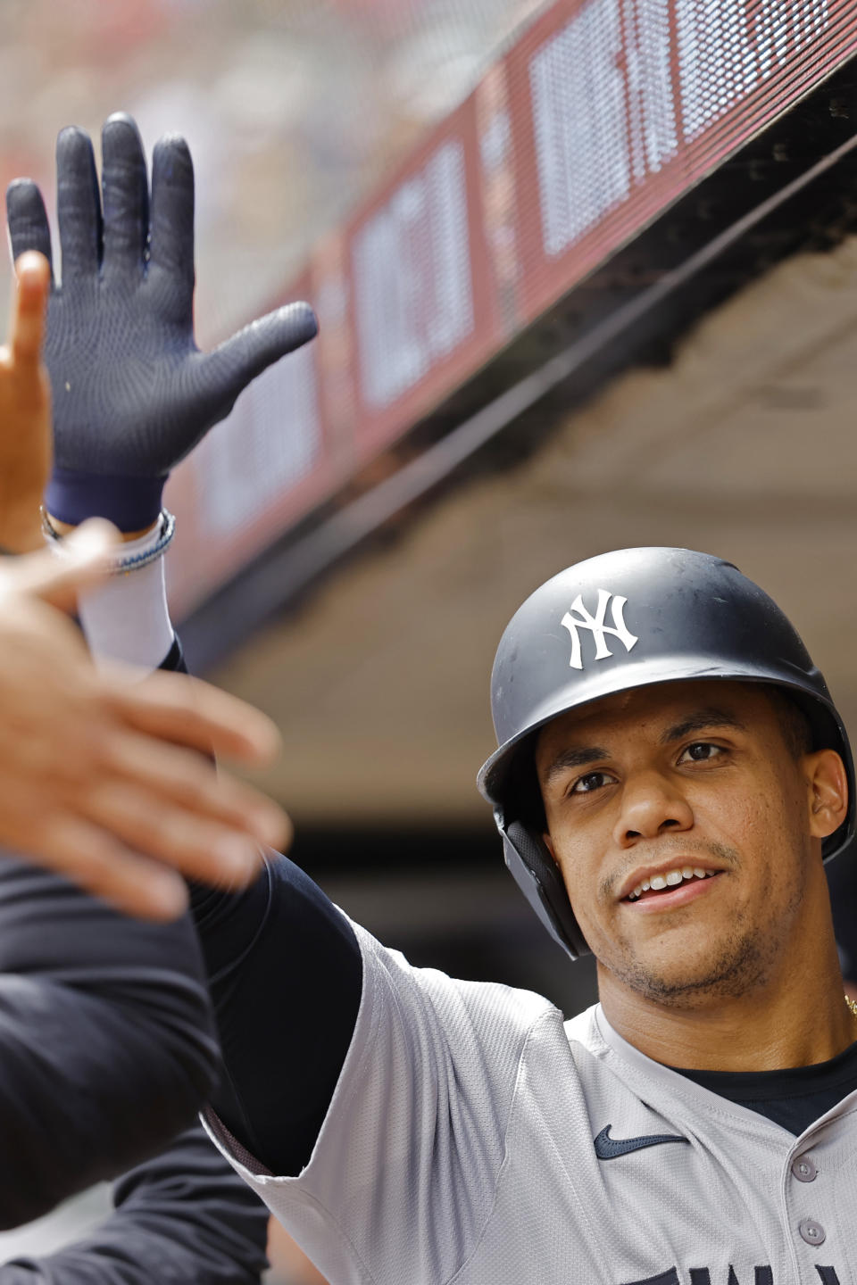 New York Yankees' Juan Soto celebrates scoring on a sacrifice fly against the Minnesota Twins in the seventh inning of a baseball game Thursday, May 16, 2024, in Minneapolis. (AP Photo/Bruce Kluckhohn)