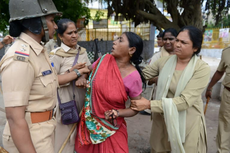 A member of India's Dalit social caste is detained during a protest against an earlier attack on Dalits in the town of Una near Ahmedabad, western Gujarat state, on July 20, 2016
