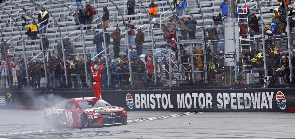 Kyle Busch celebrates after winning during a NASCAR Cup Series auto race, Monday, April 16, 2018 in Bristol, Tenn. (AP Photo/Wade Payne)
