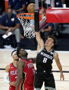 Sacramento Kings' Bogdan Bogdanovic (8) goes up for a basket against New Orleans Pelicans' Zion Williamson (1) and Josh Hart (3) during the second half of an NBA basketball game Thursday, Aug. 6, 2020 in Lake Buena Vista, Fla. (AP Photo/Ashley Landis, Pool)