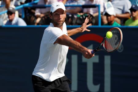 Jul 24, 2016; Washington, DC, USA; Ivo Karlovic of Croatia hits a backhand against Gael Monfils of France (not pictured) in the men's singles final of the Citi Open at Rock Creek Park Tennis Center. Monfils won 5-7, 7-6(6), 6-4. Mandatory Credit: Geoff Burke-USA TODAY Sports