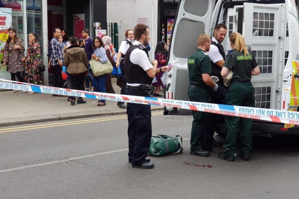 Police and paramedics at the scene of the stabbing in Green Street: @FozluSays/Twitter