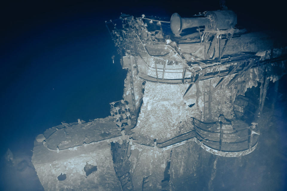 USS Yorktown 3: 
Standing tall above the leaning flight deck, the shipʻs island is the most prominent feature on USS Yorktown, heavily damaged by intense fire and heat. Photo captured by ROV Atalanta on September 9-10, 2023. (Ocean Exploration Trust, NOAA)