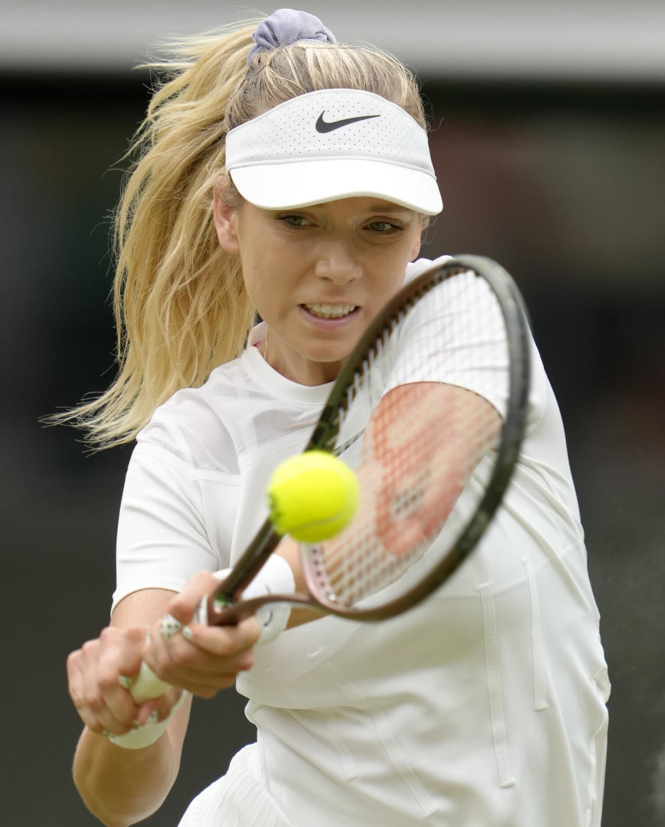 Britain's Katie Boulter returns to Karolina Pliskova of the Czech Republic in a second round women's singles match on day four of the Wimbledon tennis championships in London, Thursday, June 30, 2022. (AP Photo/Kirsty Wigglesworth)