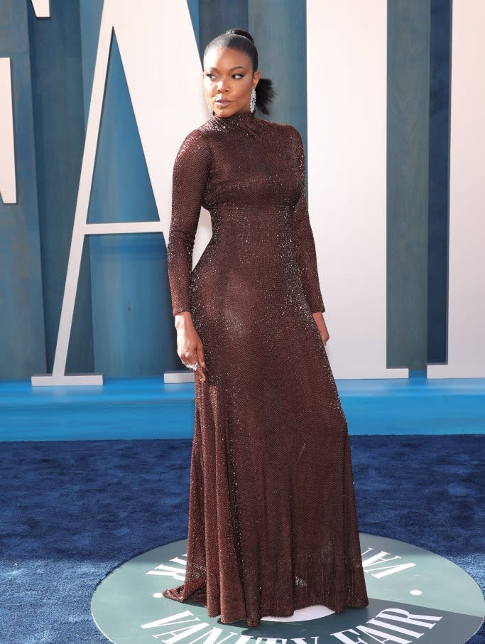 Gabrielle Union wore a chocolate brown gown featuring a subtly see-through design. - Credit: Variety