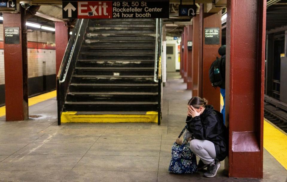 A dancer who did not make the cut makes a call in the subway station under Radio City Music Hall. JUSTIN LANE/EPA-EFE/Shutterstock