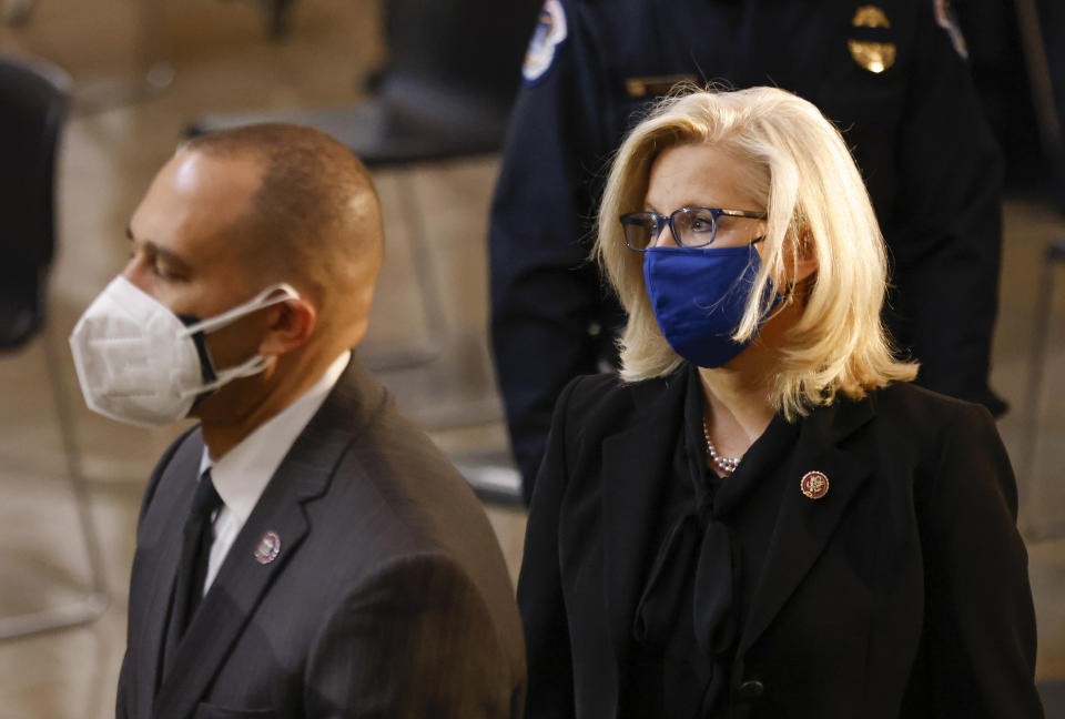 Rep. Liz Cheney, R-Wyo., attends a ceremony memorializing U.S. Capitol Police officer Brian Sicknick, as an urn with his cremated remains lies in honor on a black-draped table at the center of the Capitol Rotunda, Wednesday, Feb. 3, 2021, in Washington. (Carlos Barria/Pool via AP)