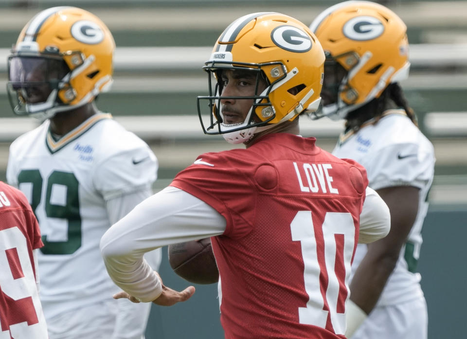 FILE - Green Bay Packers' Jordan Love drops back to pass during an NFL football mini camp practice session Wednesday, June 14, 2023, in Green Bay, Wis. The Packers have scheduled two separate sessions of joint practices to give new starting quarterback Jordan Love more opportunities to work with his young receiving group before the season begins. (AP Photo/Morry Gash, File)