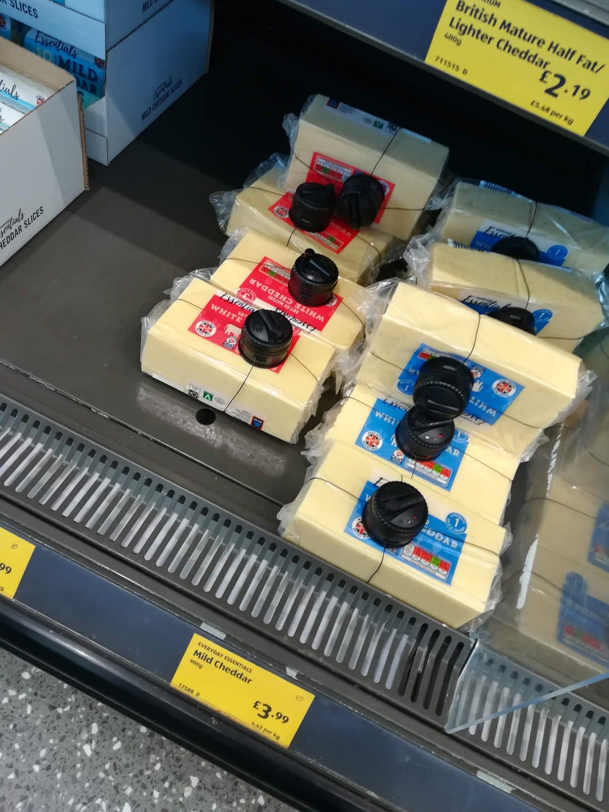 Cheese covered in security tags in Aldi (@Celeste_Tam42)