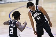 Los Angeles Clippers guard Patrick Beverley, left, celebrates with guard Terance Mann after scoring during the second half in Game 3 of the NBA basketball Western Conference Finals against the Phoenix Suns Thursday, June 24, 2021, in Los Angeles. (AP Photo/Mark J. Terrill)