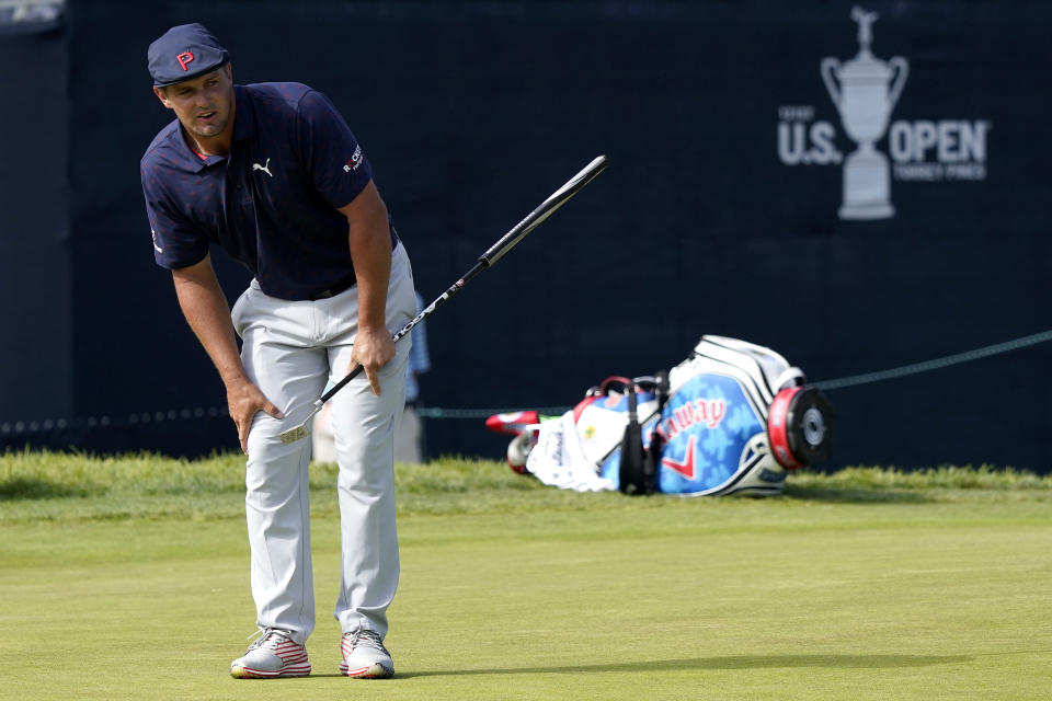 Bryson DeChambeau watches his putt miss the cup on the 18th green during the third round of the U.S. Open Golf Championship, Saturday, June 19, 2021, at Torrey Pines Golf Course in San Diego. (AP Photo/Marcio Jose Sanchez)