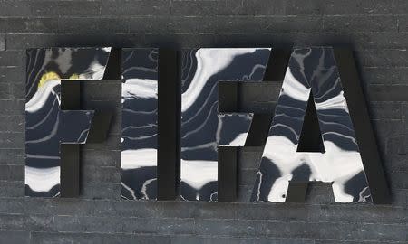 The FIFA logo is seen at the FIFA headquarters in Zurich, Switzerland March 18, 2016. REUTERS/Ruben Sprich/Files