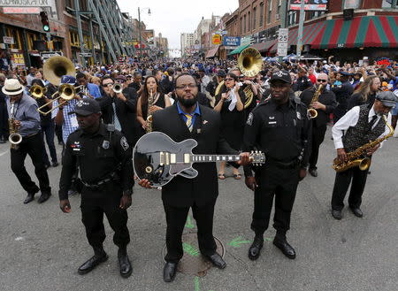 Rodd Bland, son of blues singer Bobby "Blue" Bland, carries the iconic Gibson guitar named "Lucille" belonging to the late B.B. King during a procession down Beale Street in Memphis, Tennessee May 27, 2015. REUTERS/Mike Blake