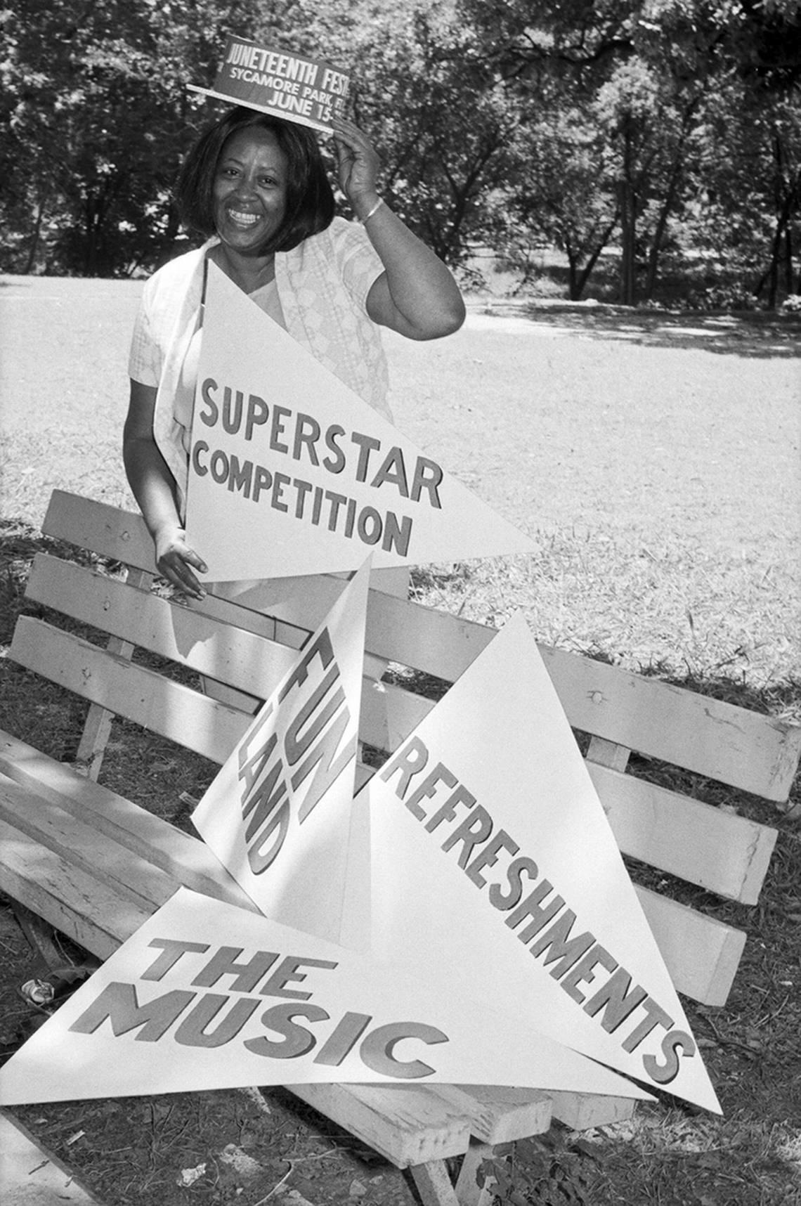 In 1975, Dorothy Johnson, who works with the Community Development Fund, gives some helpful directions for persons interested in the superstar adult sports competition, one of the many events at the Juneteenth festival in Sycamore Park.