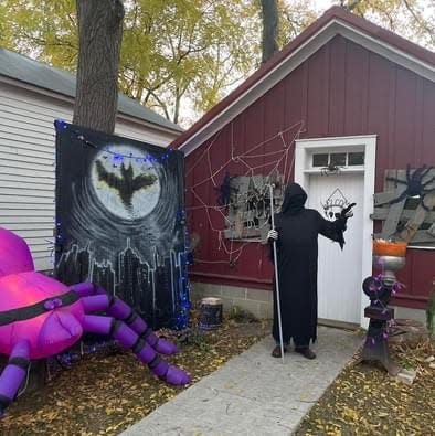 A person dressed as the Grim Reaper at the Sanilac County Historic Village and Museum's Haunted Village event on Oct. 16, 2022