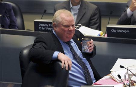 Toronto Mayor Rob Ford sips a cup of coffee during a city council meeting in Toronto November 15, 2013. REUTERS/Jon Blacker