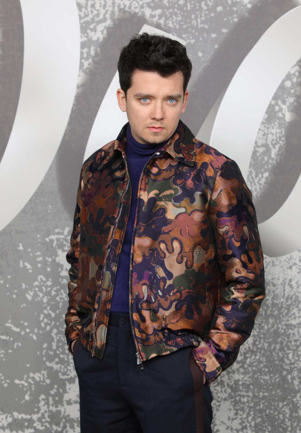 closeup of Asa in a colorful jacket at an event
