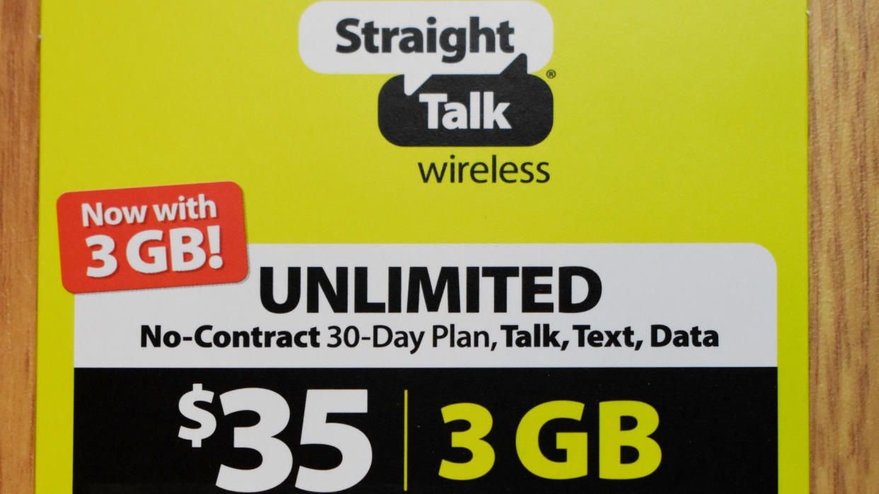 Syracuse, New York, USA - February 13, 2020: Prepaid no-contract mobile phone service plan card from Straight Talk Wireless sold by Walmart with unlimited talk, text, and data.