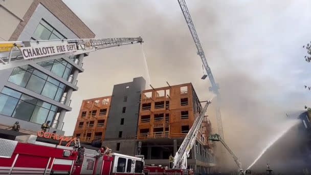 PHOTO: Firefighters work on the scene of a building fire in Charlotte, N.C., on May 18, 2023. (Charlotte Fire Department)