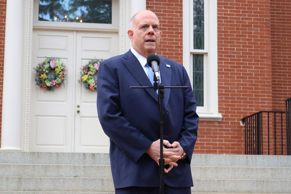 FILE - In this Monday, April 12, 2021, file photo, Maryland Gov. Larry Hogan talks to reporters at the governor's residence on the last day of the state's legislative session in Annapolis, Md. On Wednesday, May 12, 2021, Hogan announced that Maryland restaurants can resume normal operations beginning the upcoming weekend and that all remaining capacity and distancing restrictions will be lifted on indoor and outdoor dining. (AP Photo/Brian Witte, File)