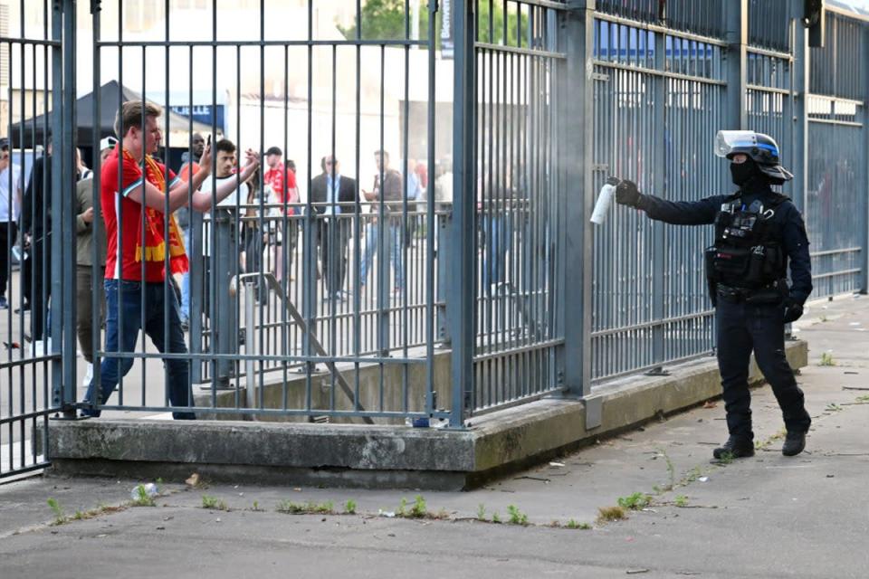 Police spray tear gas at Liverpool fans outside the stadium prior to the UEFA Champions League final match between Liverpool FC and Real Madrid at Stade de France (Getty Images)