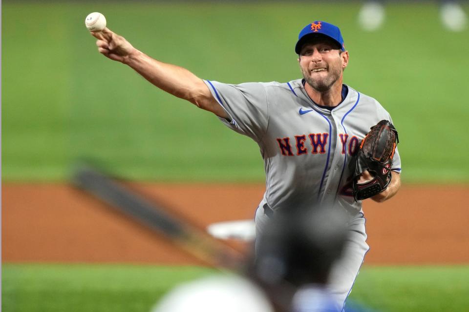 New York Mets starting pitcher Max Scherzer throws to Miami Marlins' Jorge Soler during the second inning of an opening day baseball game, Thursday, March 30, 2023, in Miami.