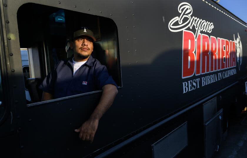 PARAMOUNT, CA - MARCH 20, 2024: Taco truck owner Bryan Tecun of Highland sits in the drivers seat of his truck where on March 10 he was stabbed while fighting with a thief who robbed a woman near his food truck on March 20, 2024 in Paramount, California. Tecun drove his taco truck down the street to block the thief and then jumped out to fight the man. He didn't realize he was stabbed until taken to the hospital in an ambulance.(Gina Ferazzi / Los Angeles Times)