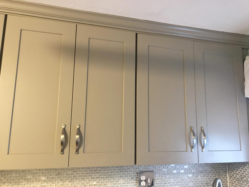 Gray cabinets brighten up our petite kitchen and visually extend the room. (Courtesy Chrissy Callahan)