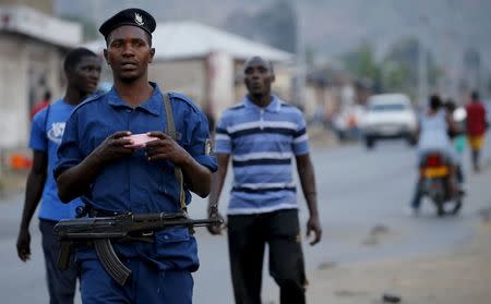 Burundi police patrol the streets of Musaga district in the capital Bujumbura after the results of this weeks presidential elections were released, July 24, 2015. REUTERS/Mike Hutchings