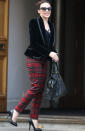 Kylie Minogue went for tailored tartan trousers and heels