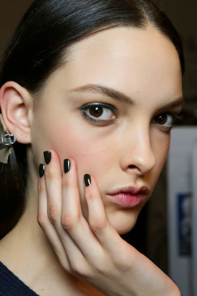 <b>Daks </b><br><br>Models wore green eyeliner and peachy blusher.<br><br>Image © Revlon