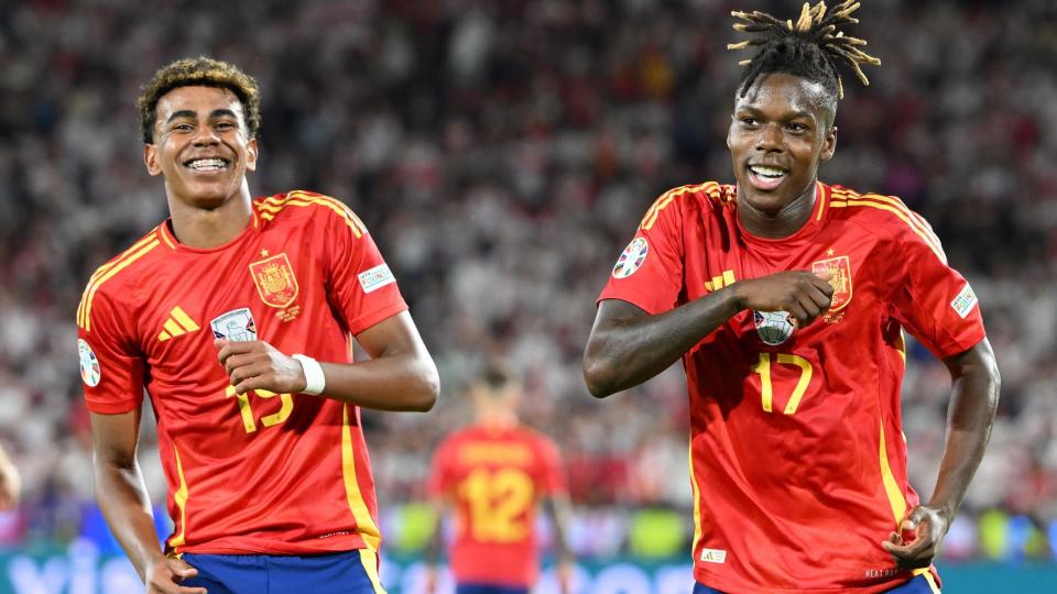 Lamine Yamal and Nico Williams dance in celebration after Spain score a goal at Euro 2024