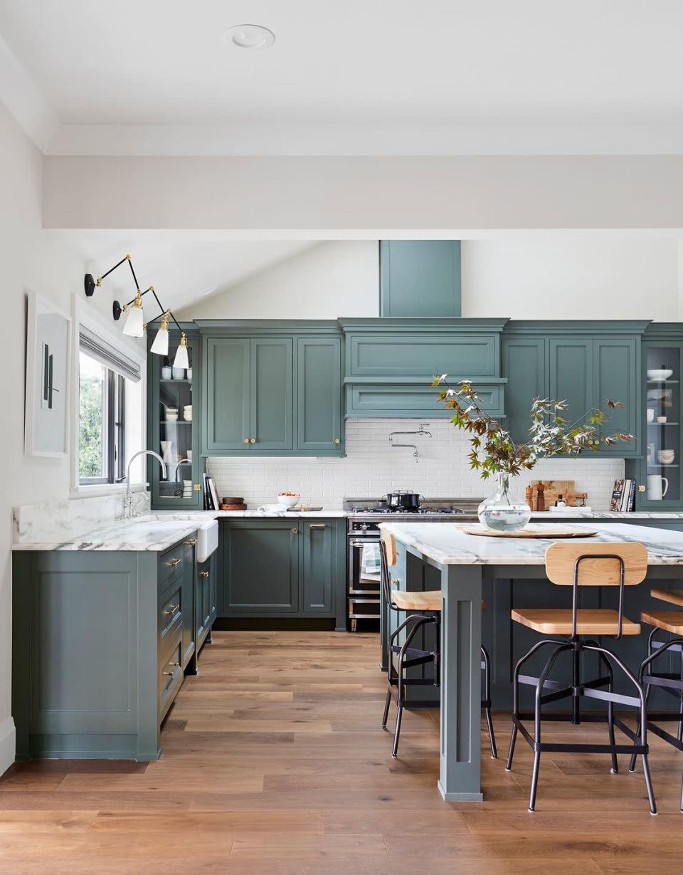 <p>“We’re seeing a move toward colors that are darker and moodier, but also grounded in nature. We expect interest in those hues to extend toward kitchen cabinets. Blues and greens work well because of the variety in those color families, and they provide a sense of comfort.” — Sue Wadden of <a href="https://www.sherwin-williams.com/" rel="nofollow noopener" target="_blank" data-ylk="slk:Sherwin-Williams" class="link ">Sherwin-Williams</a></p>