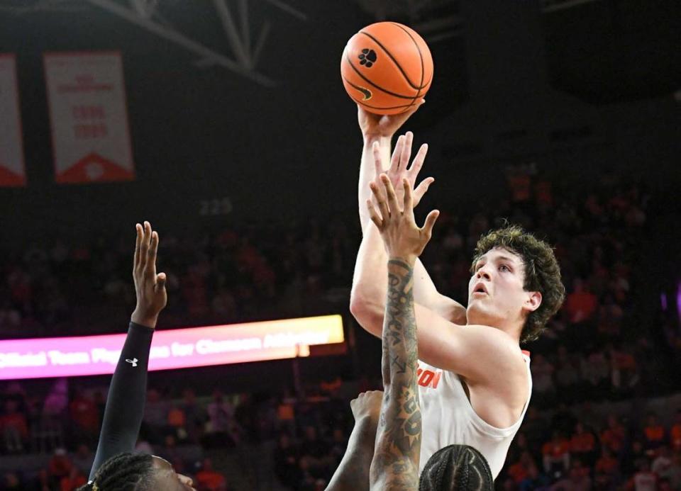 Dec 6, 2023; Clemson, South Carolina, USA; Clemson junior forward PJ Hall (24) makes a shot near University of South Carolina junior guard B.J. Mack (2) during the second half at Littlejohn Coliseum. Mandatory Credit: Ken Ruinard-USA TODAY Sports Ken Ruinard/Ken Ruinard-USA TODAY Sports